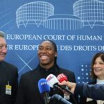 FILE - South Africa athlete Caster Semenya, center, answers reporters with lawyers Gregory Nott, left, and Shona Jolly KC after Semenya won a partial victory at the European Court of Human Rights on in her seven-year legal fight against track and field's sex eligibility rules, Thursday, July 10, 2025 in Strasbourg, eastern France. (AP Photo/Antonin Utz, File)