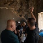 Palestinians gather to repair a damaged house following an attack by Israeli settlers the previous day in the village of Sarra, near the West Bank city of Nablus, Saturday, July 25, 2026. (AP Photo/Leo Correa)