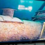FILE - This photo provided by the Michigan Department of Environment, Great Lakes, and Energy in June 2020 shows damage to anchor support EP-17-1 on the east leg of the Enbridge Line 5 pipeline in the Straits of Mackinac in Michigan, displayed on a television screen. (Michigan Department of Environment, Great Lakes, and Energy via AP, File)
