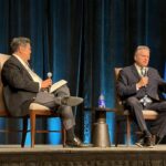 Alaska Gov. Mike Dunleavy, right, speaks on stage as Gary Mar, president and CEO of the Canada West Foundation, looks on during a talk at the Global Business Forum, in Banff, Alta., Friday, Sept. 25, 2026. THE CANADIAN PRESS/Lauren Krugel