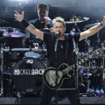 Chad Kroeger, front, of Nickelback, performs during a concert Sunday, Aug. 3, 2025, at the Pro Football Hall of Fame in Canton, Ohio. (AP Photo/David Dermer)
