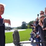 President Donald Trump speaks with reporters before boarding Marine One on the South Lawn of the White House, Thursday Oct. 1, 2026, in Washington. (AP Photo/Jacquelyn Martin)