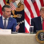 President Donald Trump listens as Defense Secretary Pete Hegseth speaks at a roundtable event in the East Room of the White House, Wednesday, Oct. 21, 2026, in Washington. (AP Photo/Alex Brandon)